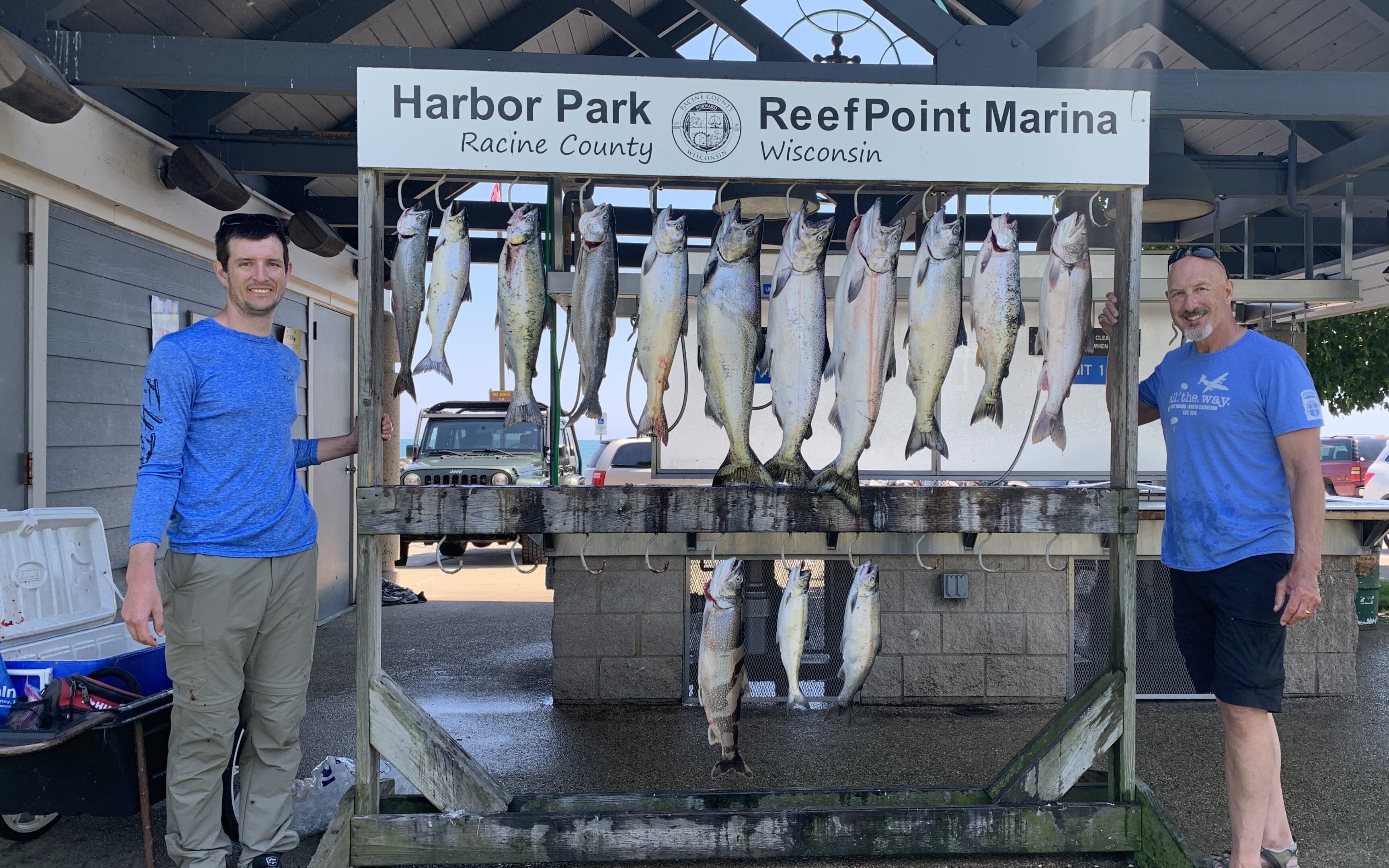 Large fish hanging at Harbor Park and Reef Point Marina.